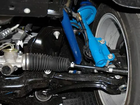 112_0609_06z+shelby_mustang_GT-H_production+front_suspension.webp