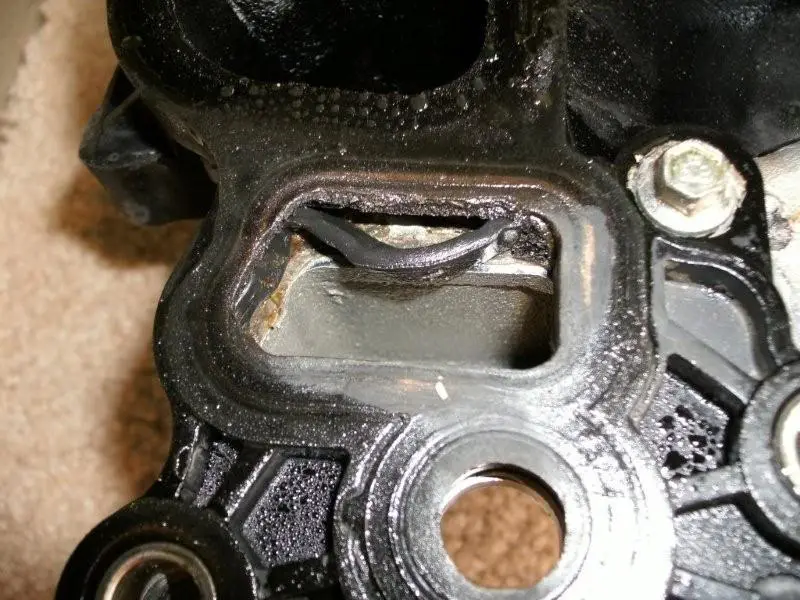 2003GTMustang46engineintakewithdama.webp