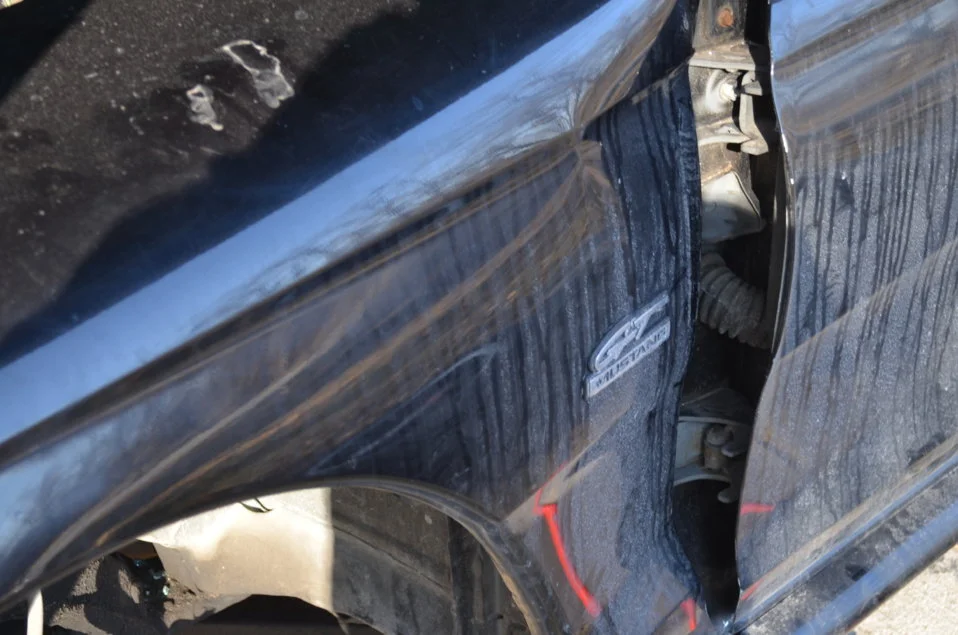 DRIVERS SIDE FENDER DENT.webp