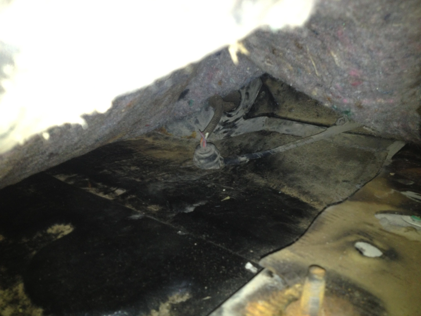 grommet under carpet.webp