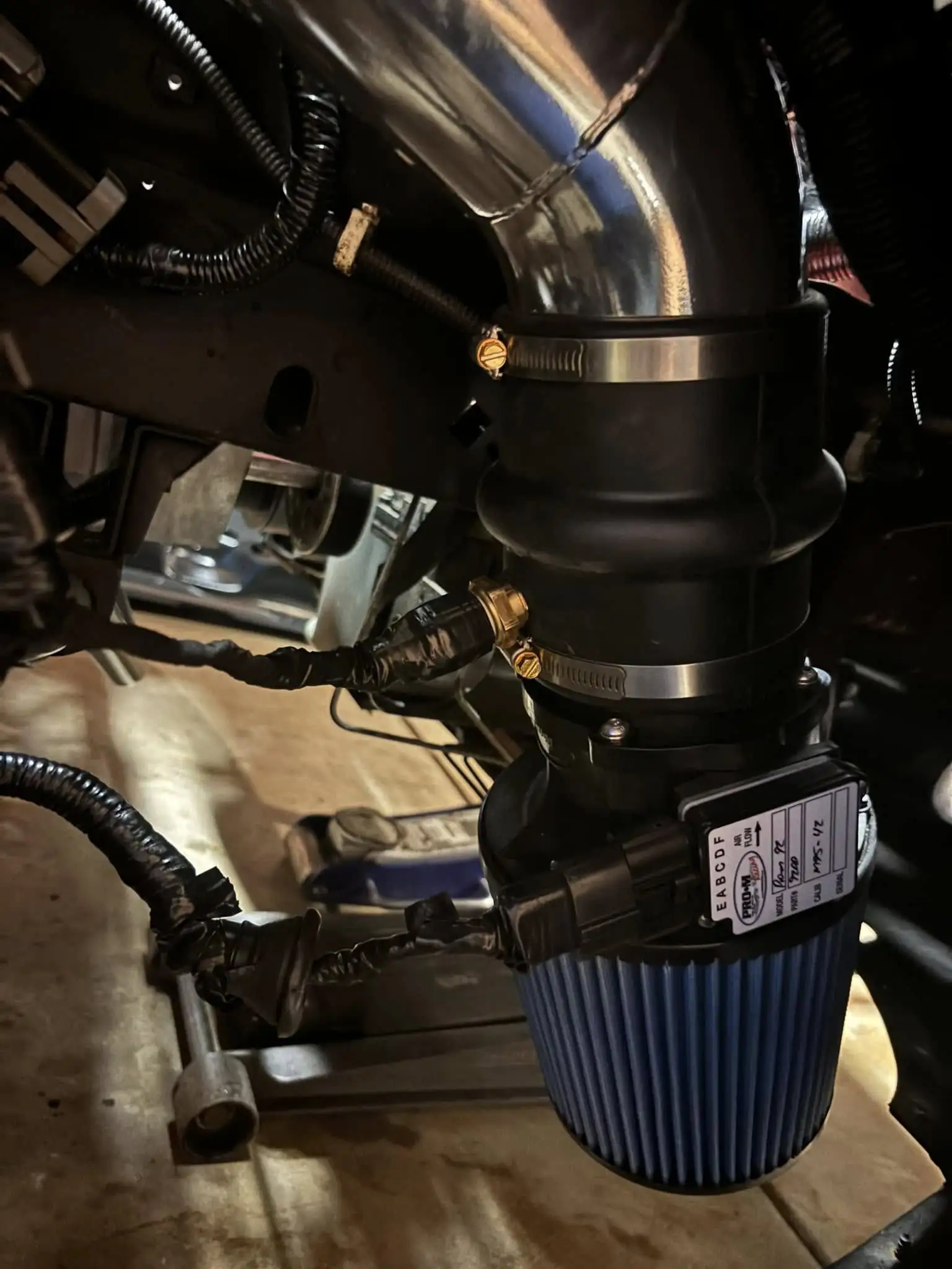 MAF sensor and filter in the fenderwell 94 95 Mustang.webp