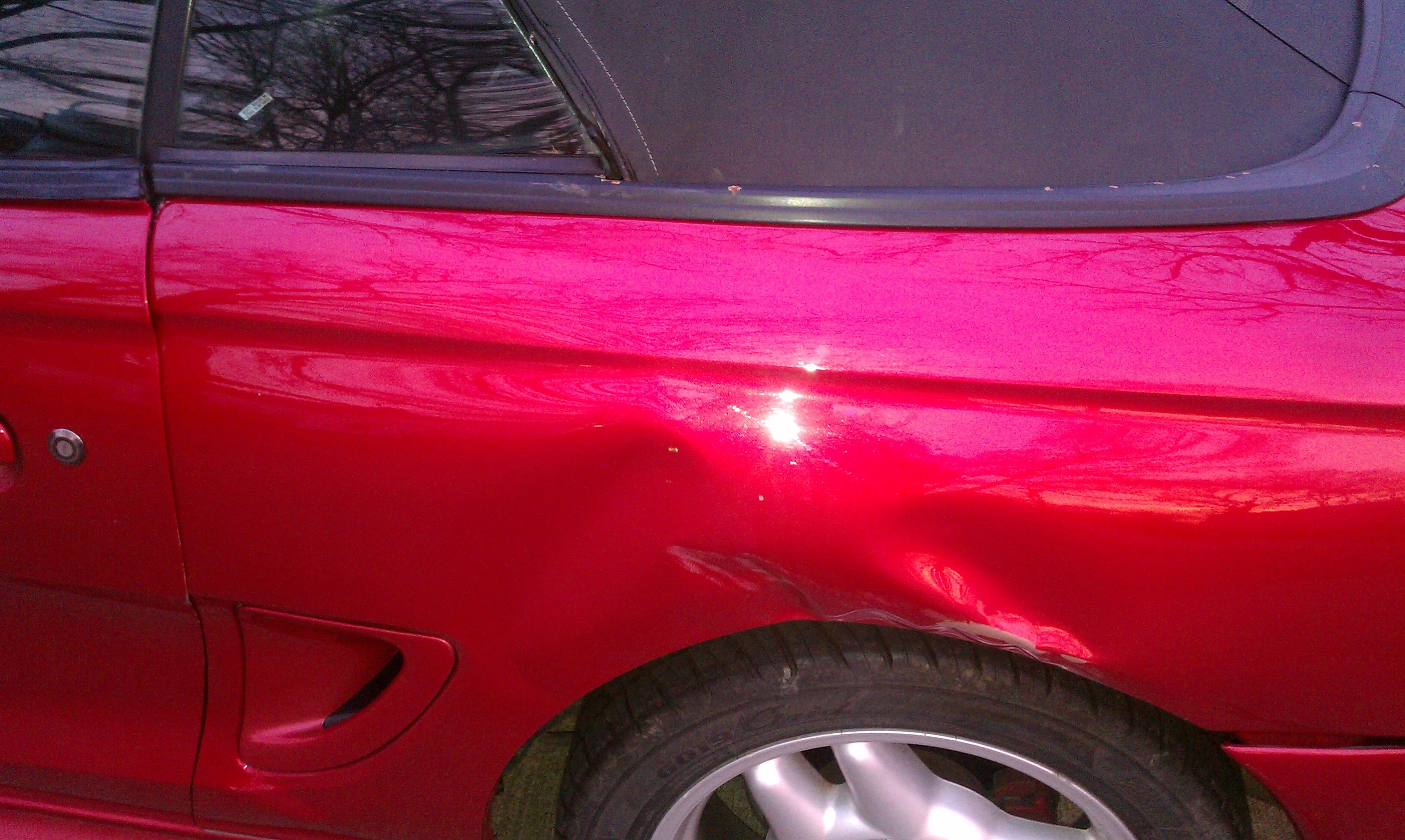 Mustang sideviewdamage.webp
